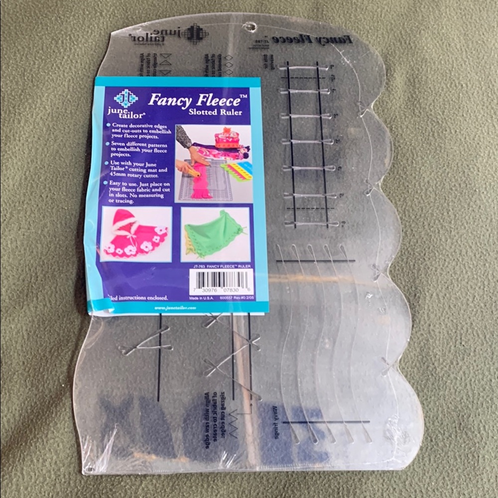 NIP Fancy Fleece Slotted Ruler. Has 7 different patterns. Approx 9 1/2” x 16”